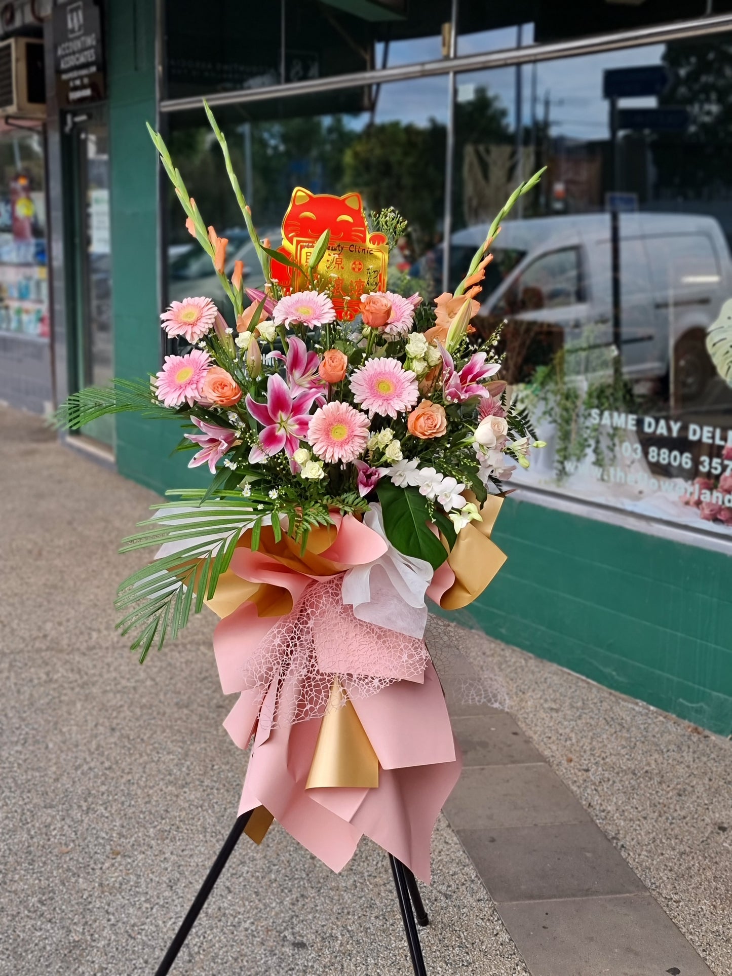Spectacular 1.6m premium Grand Opening Stand featuring a magnificent arrangement of fresh pink blossoms on a tripod outside a shop same-day delivery The Flowerland Nunawading