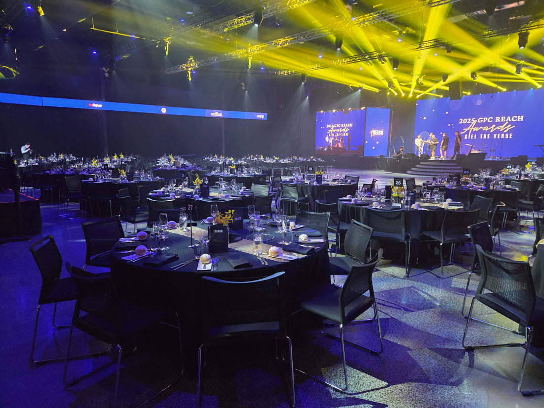 Professional floral styling for a corporate 50th Anniversary Gala at a Southbank, Melbourne event venue. Showcasing bespoke gold and yellow floral centerpieces designed by Flowerland for large-scale corporate event planning.