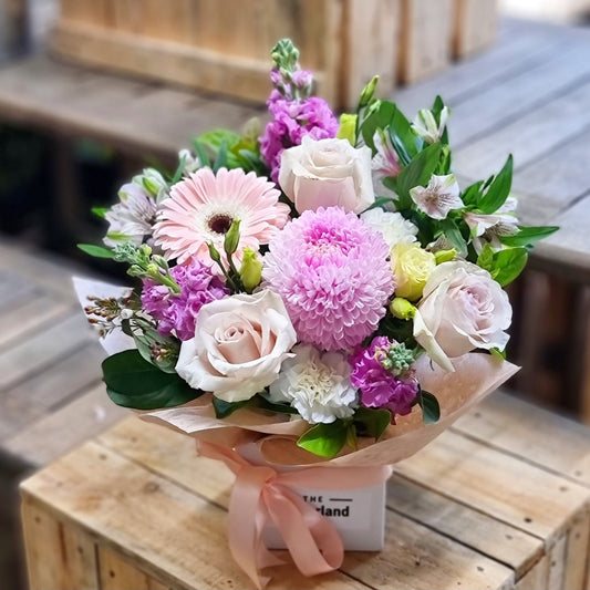 Same-day flower delivery in Mont Albert: A soft pastel floral arrangement in a gift box, reflecting the quiet elegance of Mont Albert's leafy streets.