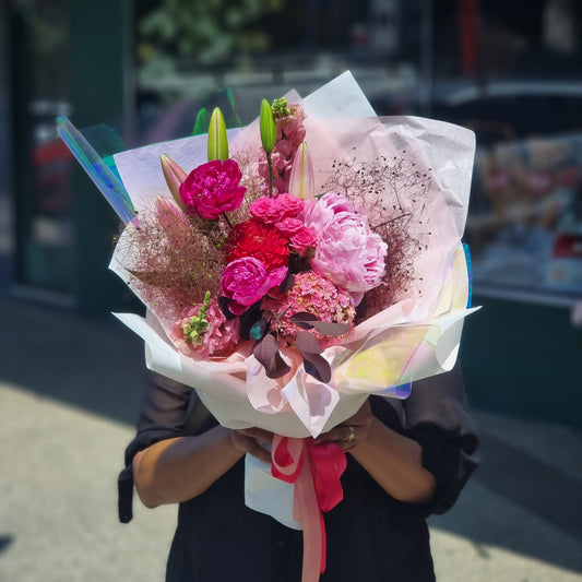 Vibrant Cherry Ripe floral bouquet filled with rich pink and red fresh market blossoms same-day delivery The Flowerland Nunawading
