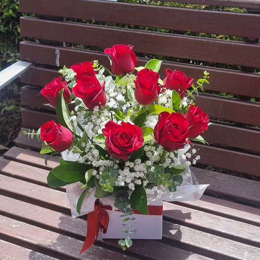 Elegant Rose Box arrangement featuring 10 premium red roses with fresh seasonal foliage and white gyp same-day delivery The Flowerland Nunawading