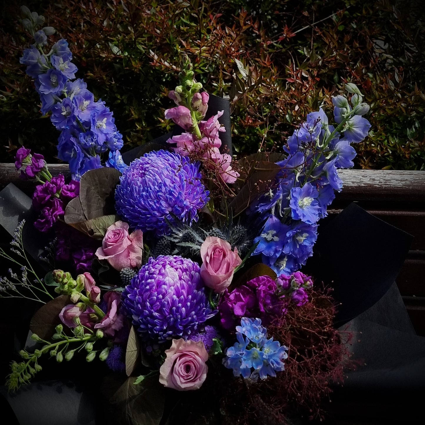 Same-day flower delivery Balwyn - Premium bouquet featuring blue delphinium, purple chrysanthemums, and pink roses handcrafted by The Flowerland.
