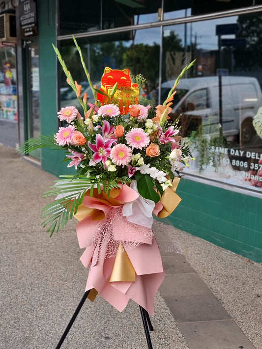 Spectacular 1.6m premium Grand Opening Stand featuring a magnificent arrangement of fresh pink blossoms on a tripod outside a shop same-day delivery The Flowerland Nunawading