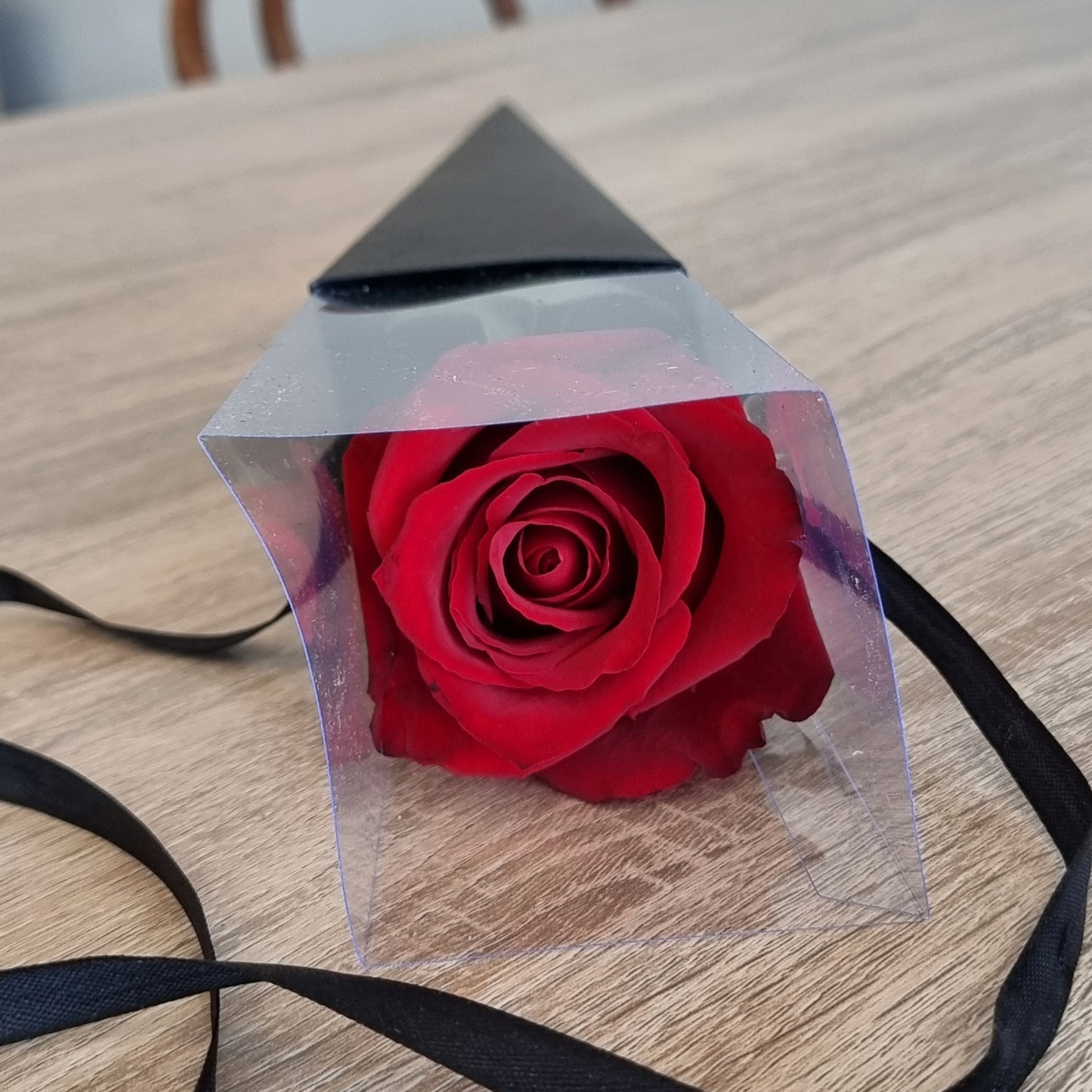 Premium single red rose romantic gift wrapped in black craft cone paper prepared for same-day delivery to recipients in Box Hill.
