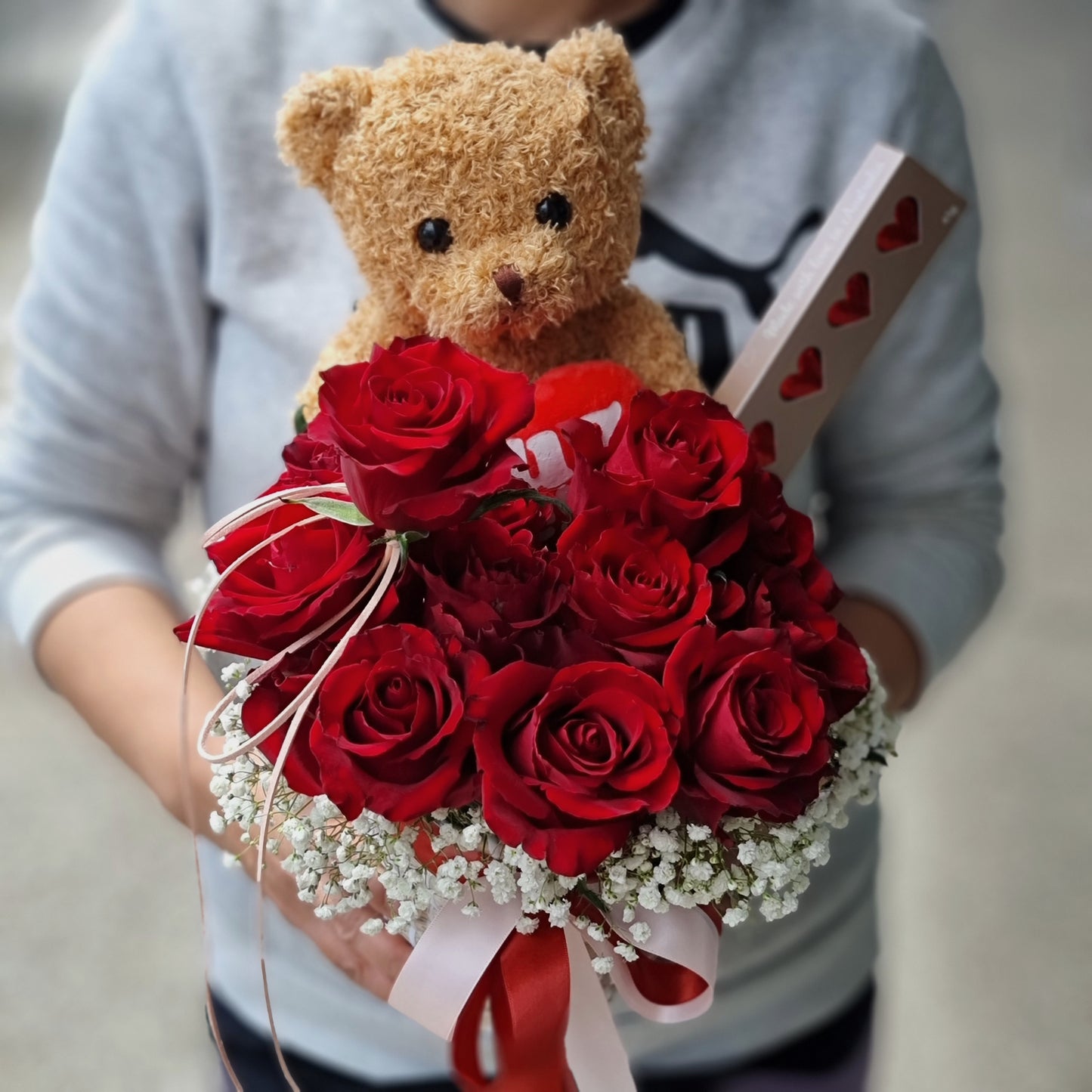 Premium 12 red roses gift basket with cuddly teddy bear ready for same-day romantic courier delivery to homes in Doncaster.