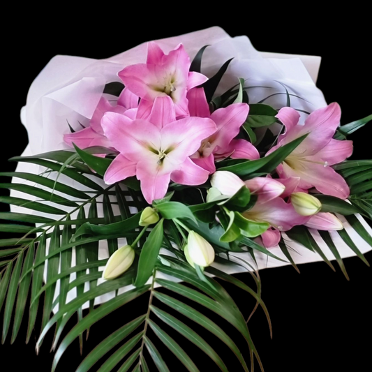 Magnificent pink Oriental Lily bouquet with premium fragrant blooms and lush palm greenery textures same-day delivery The Flowerland Nunawading