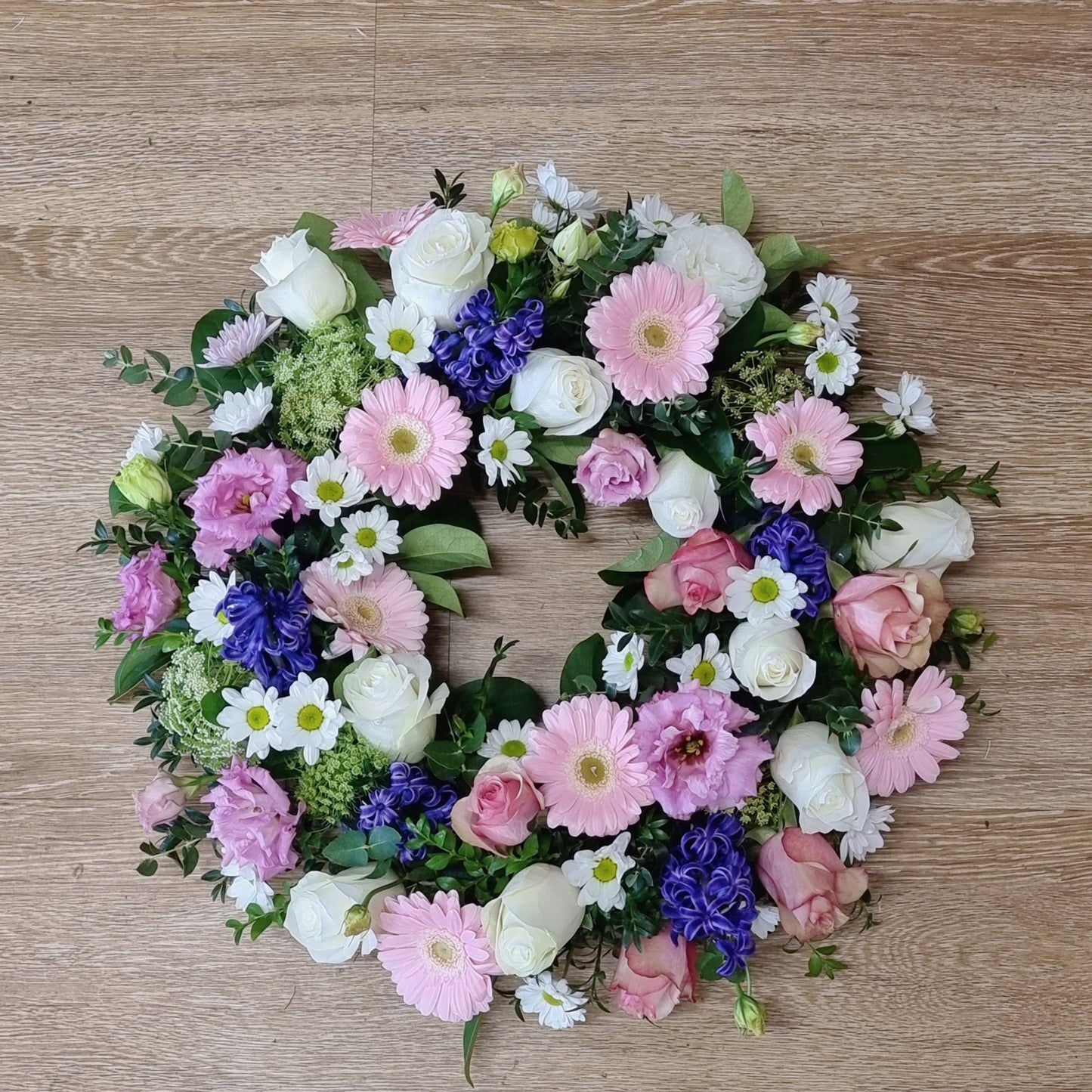 Beautiful soft pink and purple sympathy wreath for funerals and memorials | Serenity floral tribute with fresh flowers | Flowerland Nunawading