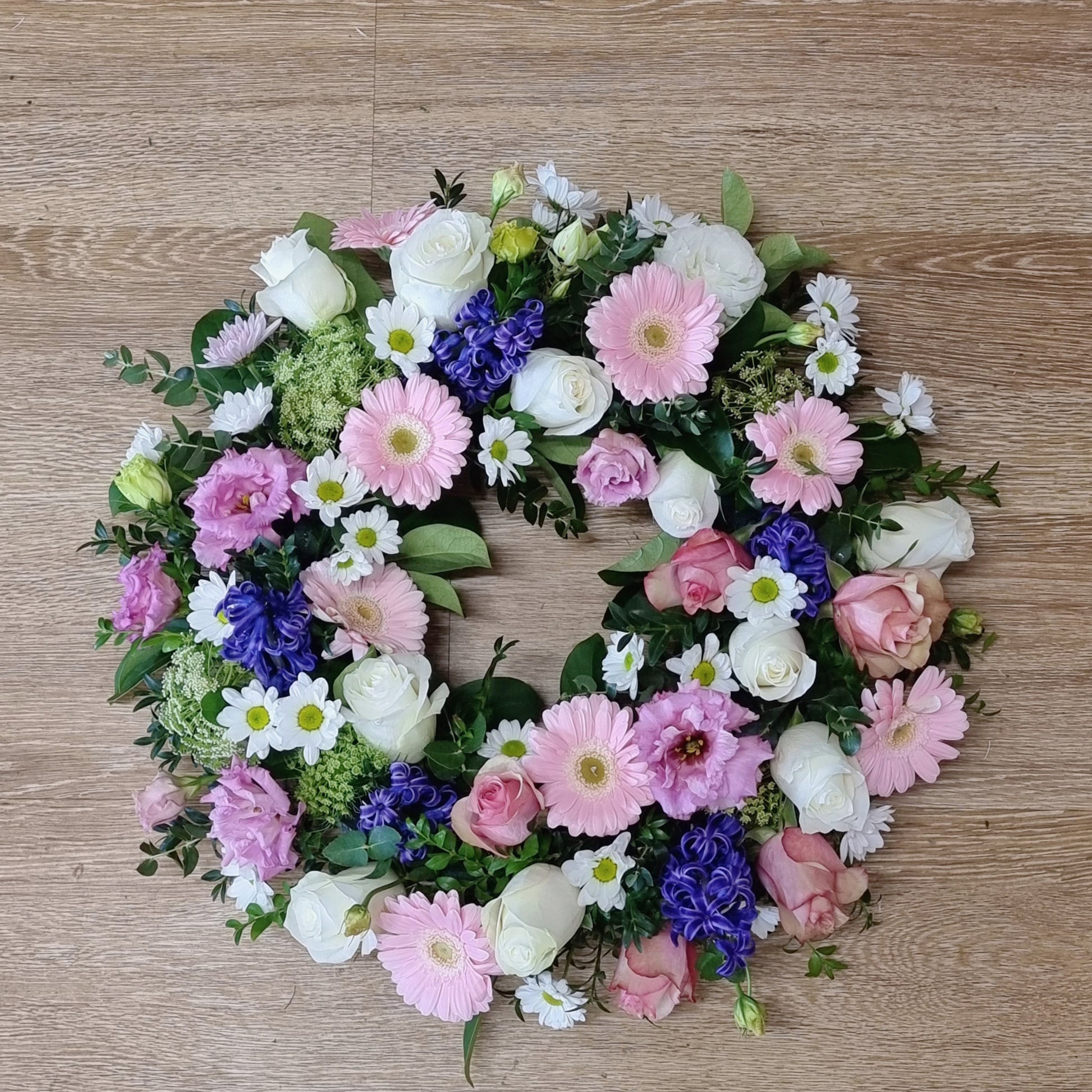 Beautiful soft pink and purple sympathy wreath for funerals and memorials | Serenity floral tribute with fresh flowers | Flowerland Nunawading