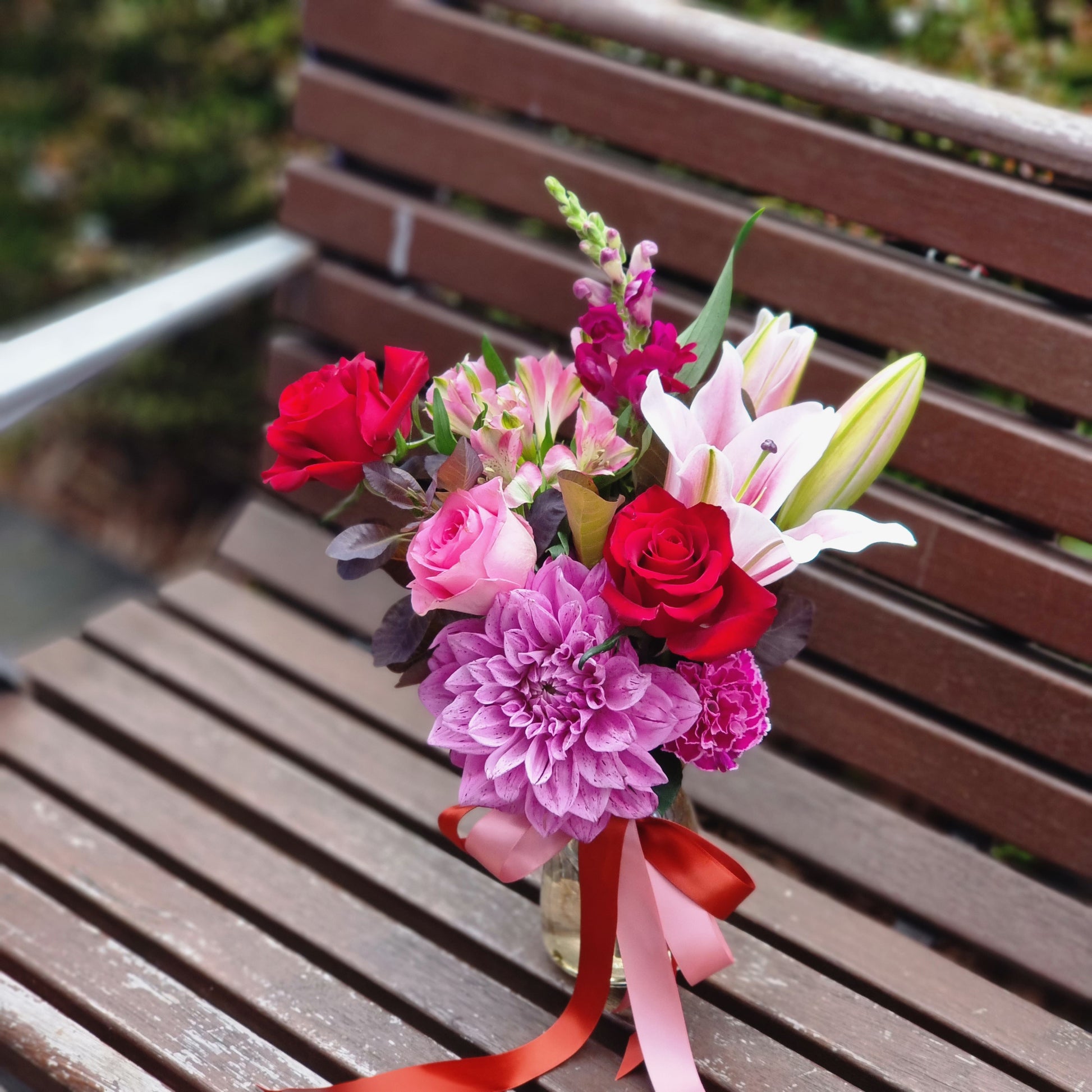 Romantic Sweet Love flower arrangement with mixed fresh blooms and burgundy foliage in a glass posy jar same-day delivery The Flowerland Nunawading