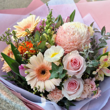 Charming pastel bouquet with unique filler greens ready for reliable same-day delivery across residential neighborhoods in the Knox region.