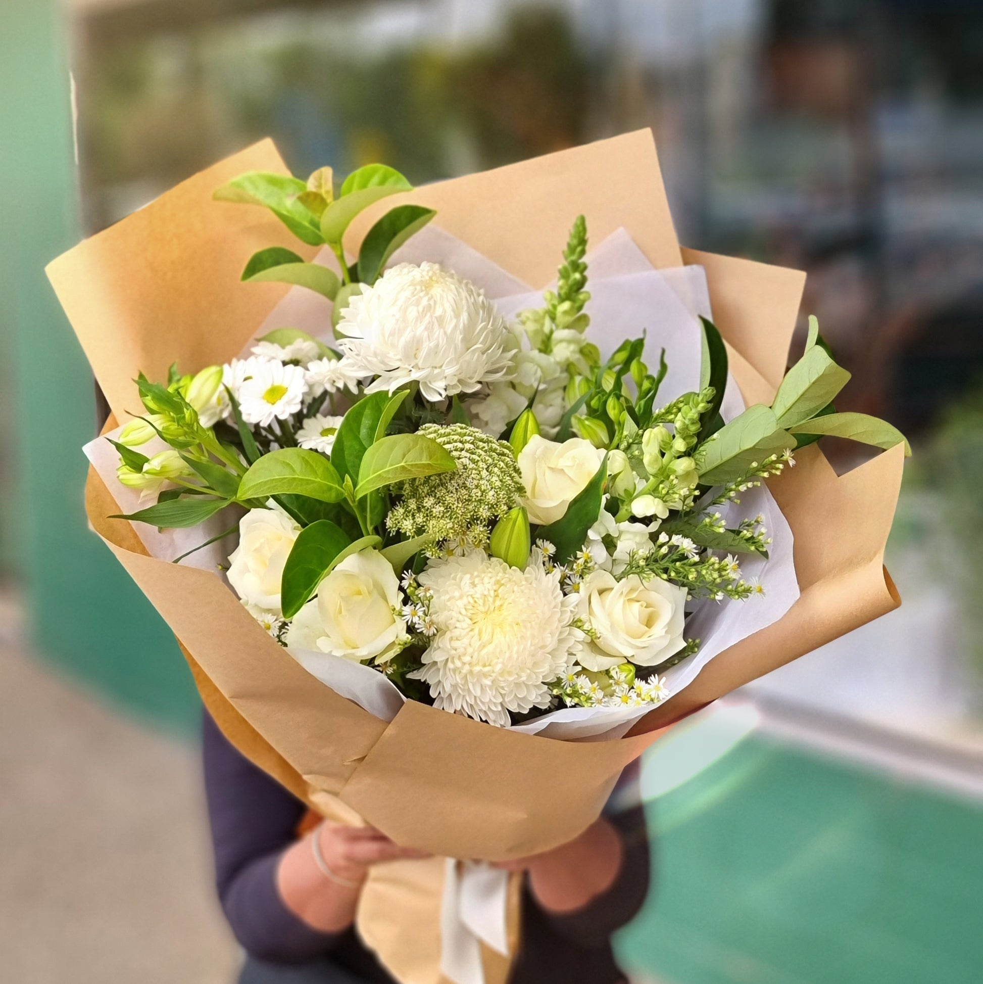 Beautiful white seasonal blossoms with snapdragons and carnations delivered straight to established properties across Mitcham.