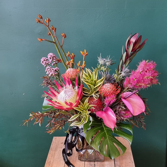Rustic Wild Flower vase arrangement featuring Australian native protea flowers and tropical foliage same-day delivery The Flowerland Nunawading