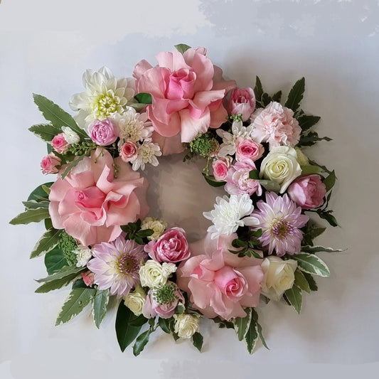 Soft pastel pink and purple sympathy wreath for funerals and memorials | Gentle and beautiful memorial flower tribute | Flowerland Nunawading