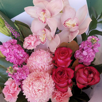 Close-up of bright pink seasonal floral bouquet handcrafted for birthday celebration gifts delivered to Doncaster.
