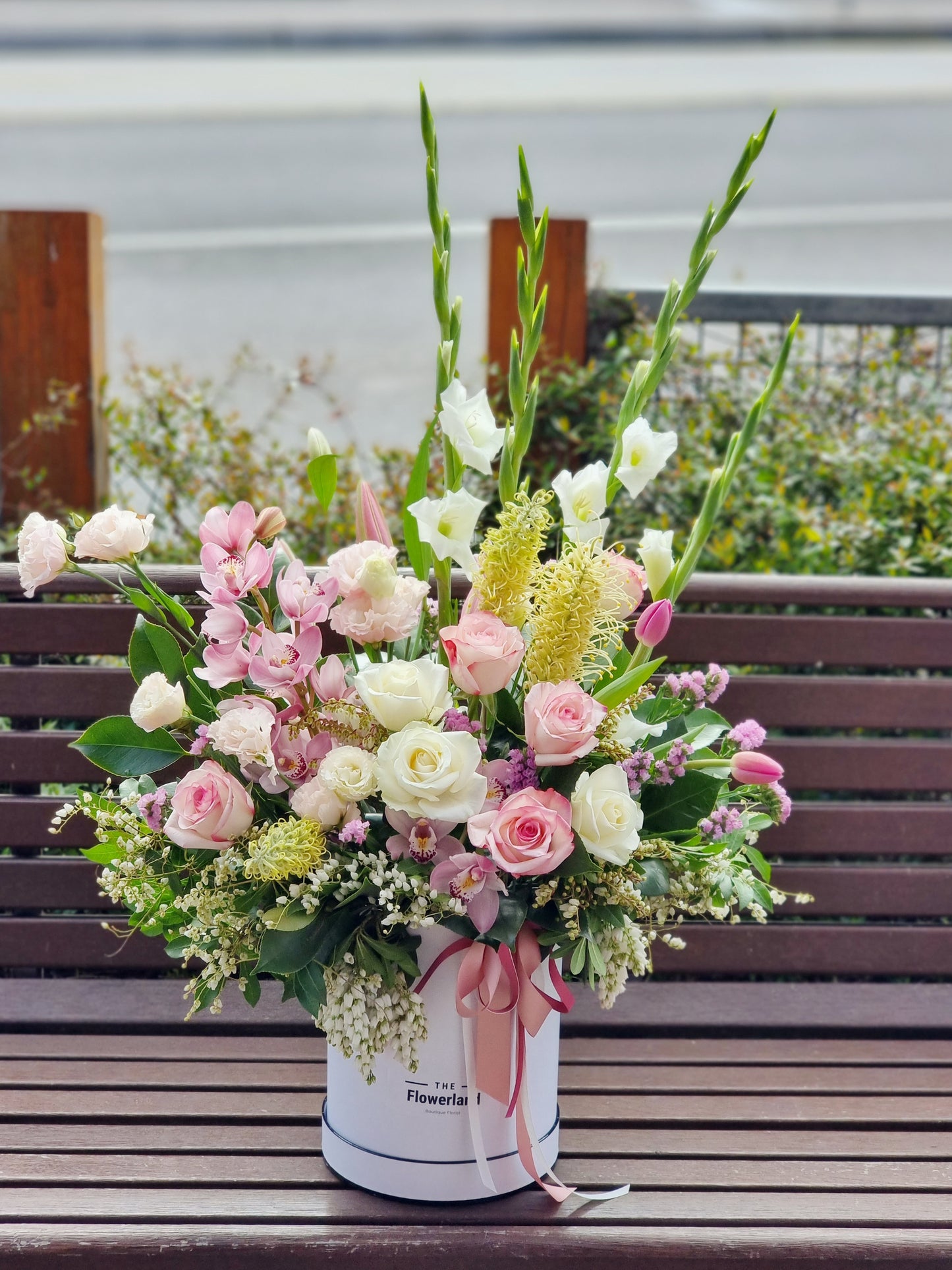 Premium bespoke seasonal blooms curated in a luxury hatbox by local florist for fast delivery across Glen Waverley.