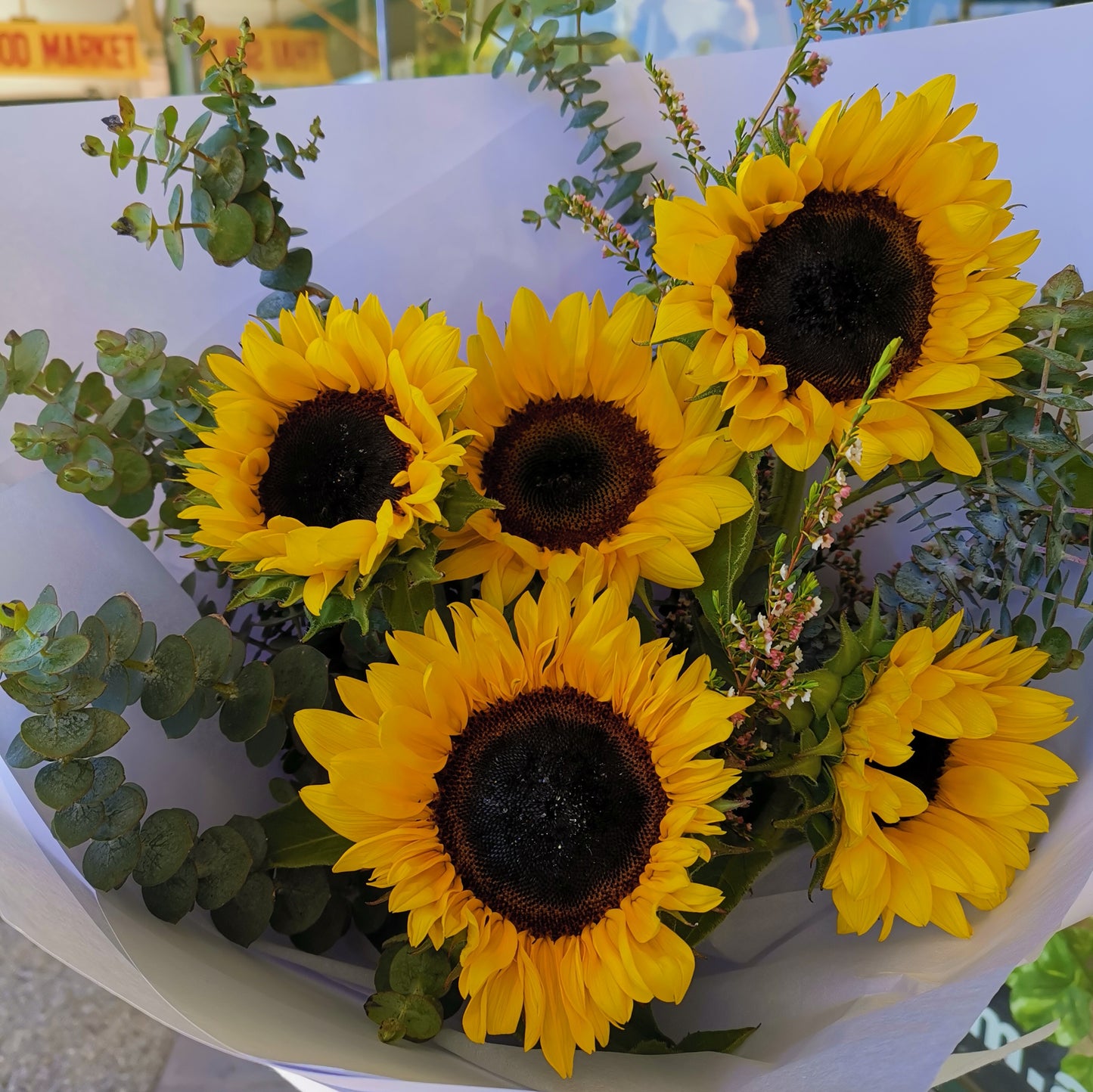 Vibrant fresh sunflowers bouquet mixed with texturized seasonal greenery same-day delivery Flowerland Nunawading