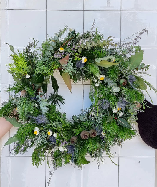 Festive fresh to dry Christmas door wreath featuring textured seasonal evergreens and holiday foliage same-day delivery The Flowerland Nunawading