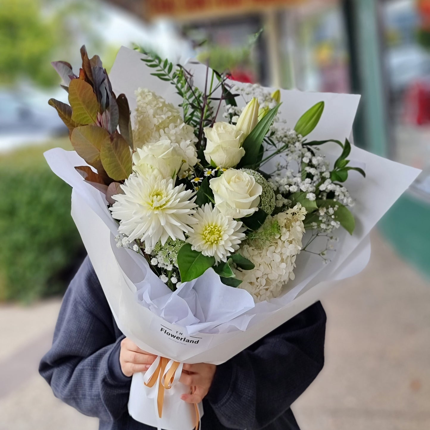 Artisanal white sympathy flower bouquet hand-delivered to homes and funeral venues in Melbourne Eastern Suburbs by local florist Flowerland.