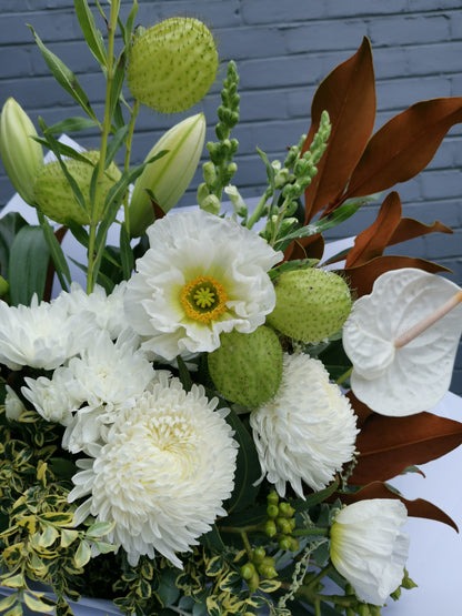 Fresh white lilies and lush green eucalyptus foliage florist choice bouquet for reliable same-day delivery in Doncaster.